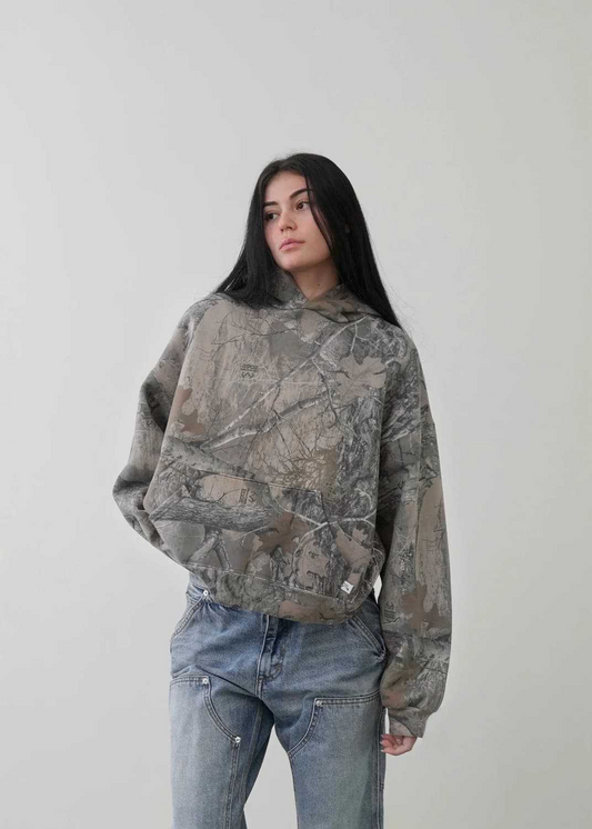 Urban camouflage hoodie showcasing its casual design